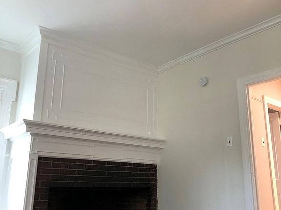 Fireplace (non-working) in bedroom