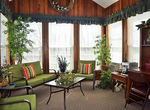 What a place to relax and unwind, a 4 seasons room off of the breakfast room.