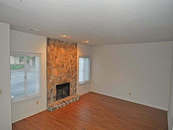 Spacious living area with fireplace.