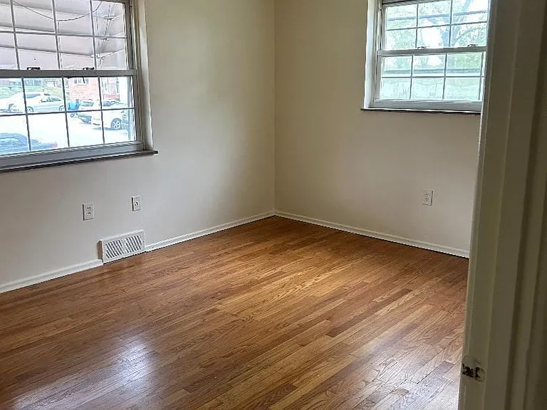 Bedroom have lots of light, hardwood, ceiling fan and good size closet