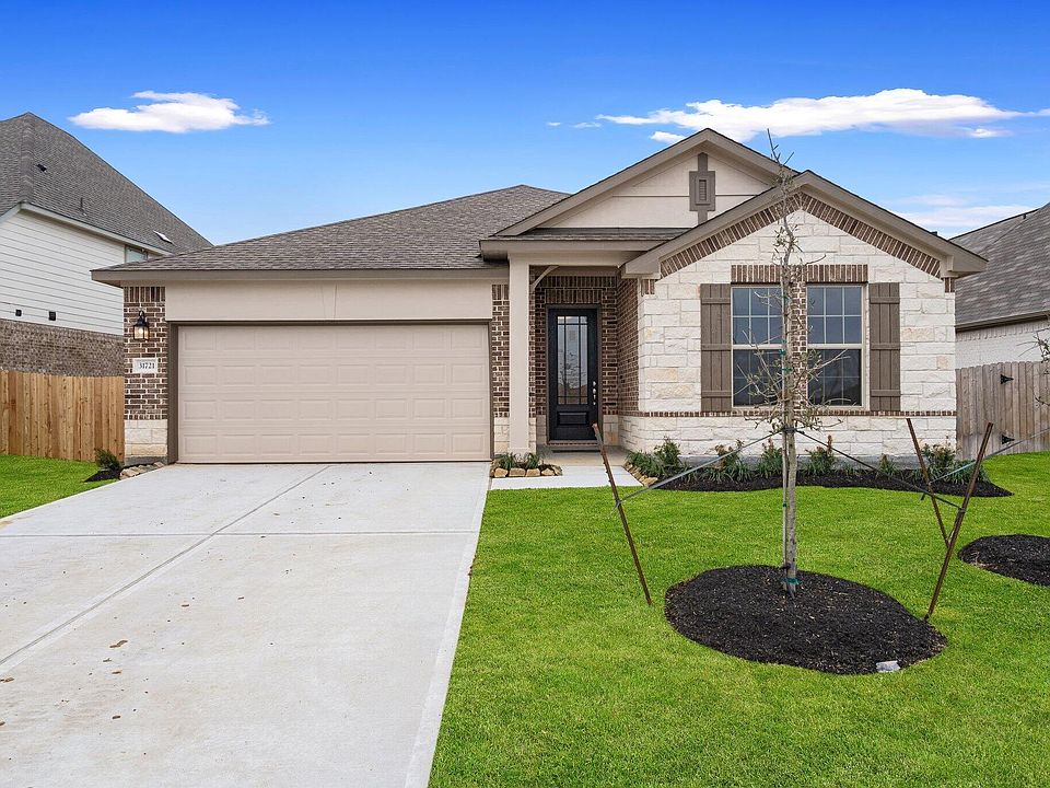 Welcome home to 31721 Redbud Blossom Lane located in the community of The Meadows at Imperial Oaks z