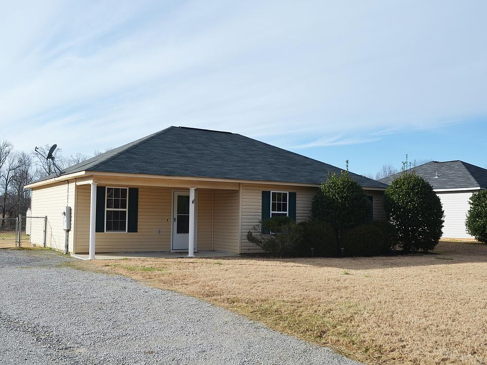 Exterior Front with gravel driveway