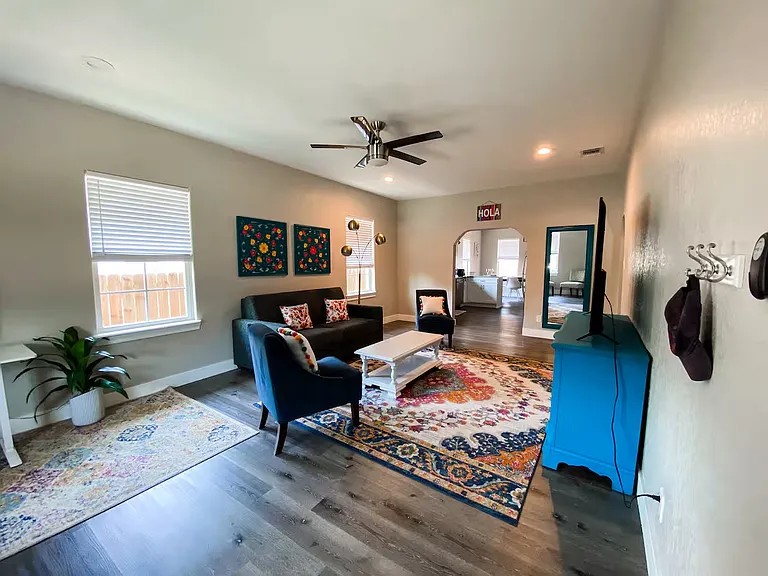 Bright and spacious open-concept living area with abundant natural light and seamless flow into the kitchen_perfect for entertaining or everyday living.