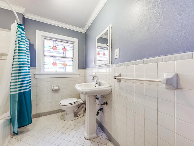 2nd bathroom located in hall by living room and 2nd bedroom