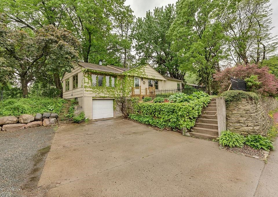 Nature's Delight - Great rambler with single car garage and 2 additional parking spaces near retaining wall.