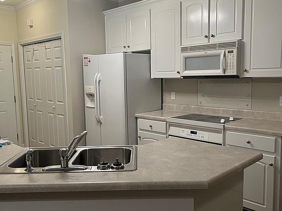 Kitchen...new appliances are stainless steel with new light fixtures.