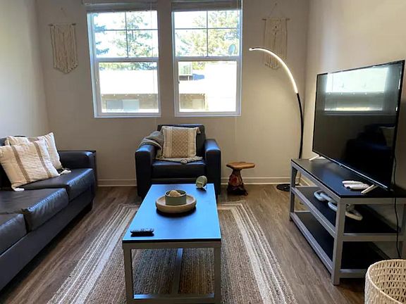 Kick back in the thoughtfully decorated living room and enjoy a program on our 55" SmartTV! Hulu, Netflix, and Disney+ are provided for your enjoyment.