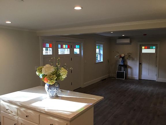 Kitchen, island with seating and Family room with surround s