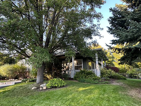Another view of front of house and mature landscaping