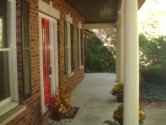 Lovely wrap around porch on both ends with special accent wood in ceiling