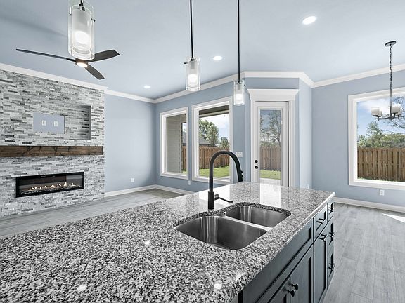 Extended island with garbage disposal button on top