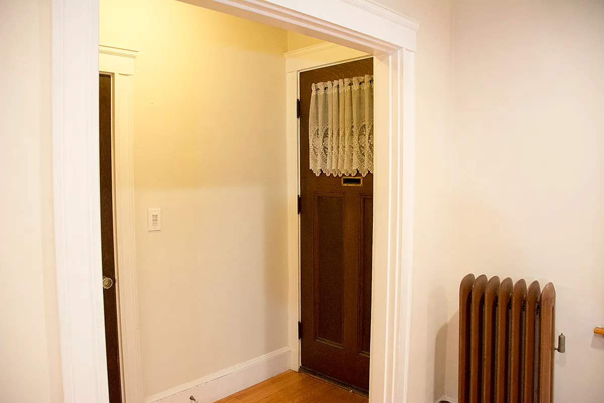 Entry hall and living room front door corner (A & D sides) - 53 Egerton Rd