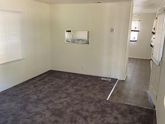 living room, new carpet, flooring and paint through out