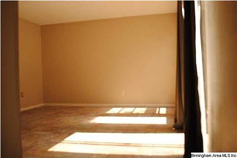 When first walk in. The main living area/Den. Sliding glass