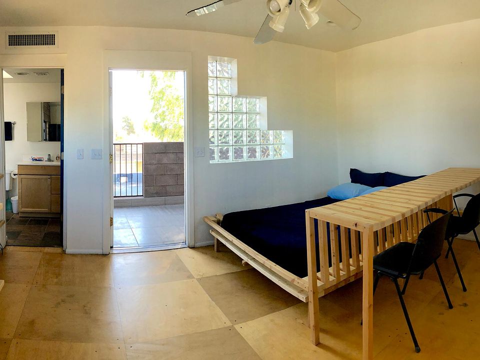 Overview of the space: kitchenette counter on the left, bath