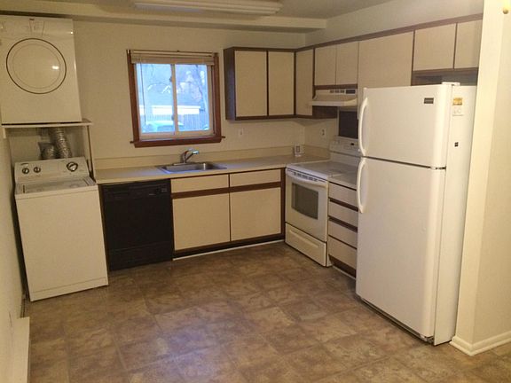 Kitchen with washer and dryer.