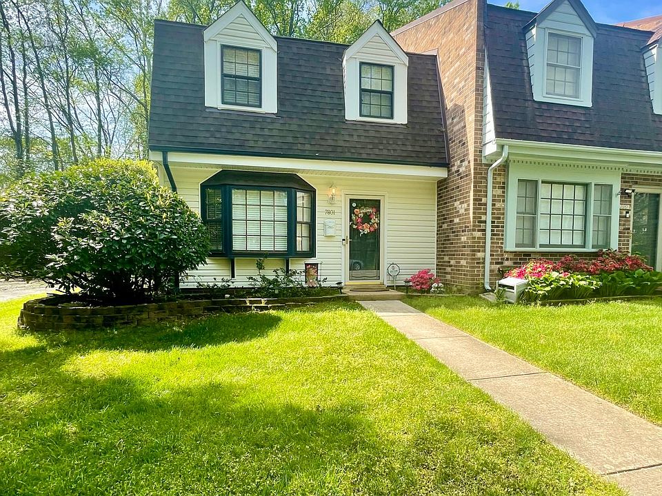 Adorable, Storybook Dutch style townhome with large bay window, low maintenance vinyl siding, Anderson Storm door and freshly painted front door/trim!