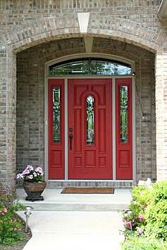 Beautiful brick home with covered porch and professional landscaping w/ sprinkler system.