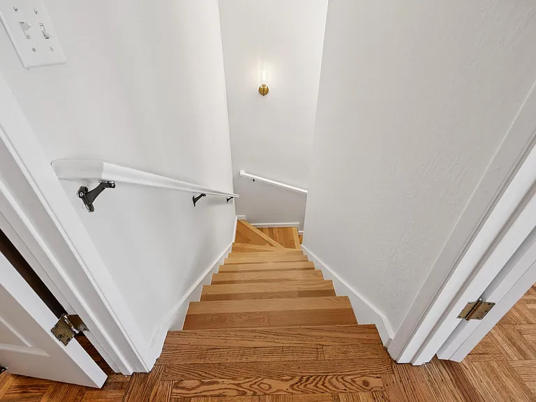 Stairs from 2nd level to 1st level.
