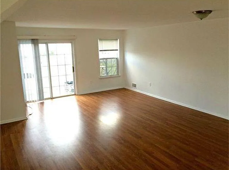 Living room opens to balcony