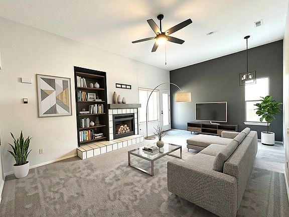 Wood burning fireplace. High ceiling. New carpet.