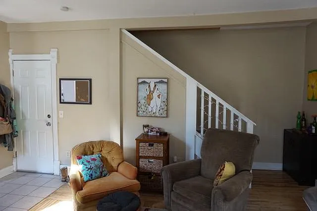 stairs leading up to 3rd floor and upper 2 bedrooms