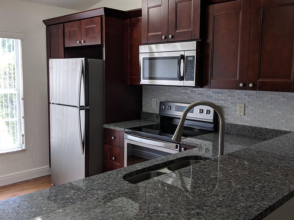 New kitchen with stainless steel appliances. Granite counter tops.