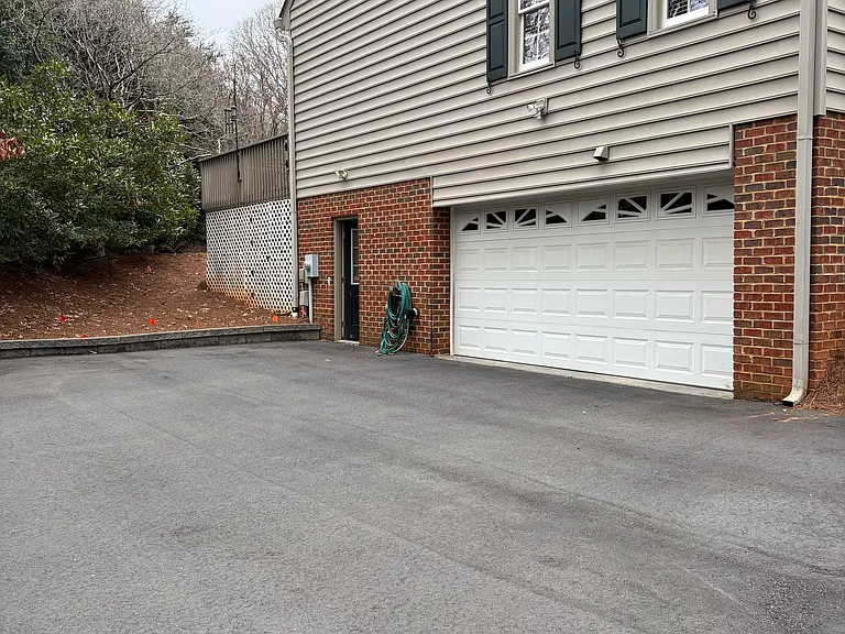 Private parking and garage behind the house