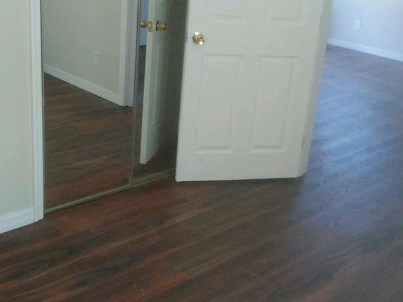 large closet in bedroom - has sliding mirror doors