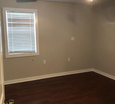 SECOND BEDROOM: We call this the outlet room bc there are 9 electric outlets in this room. Why? IDK This room has two windows, picture is the larger window, the other window is half the size.
