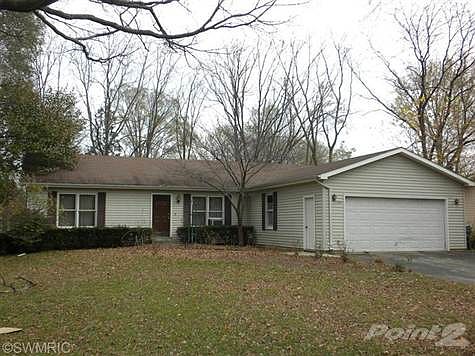 Nice large yard with mature trees. Exterior is vinyl sided.