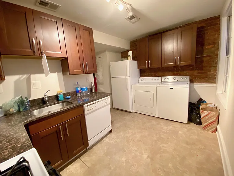 Kitchen with washer and dryer, and dishwasher