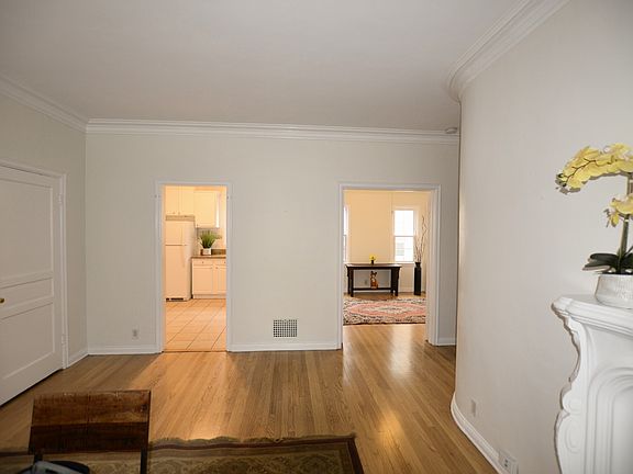 View From Living Room Into Kitchen And Small Bedroom