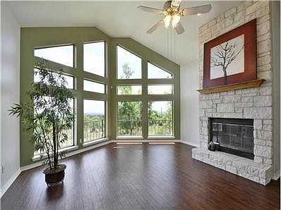 What a gorgeous living room!  The limestone, wood-burning firepl