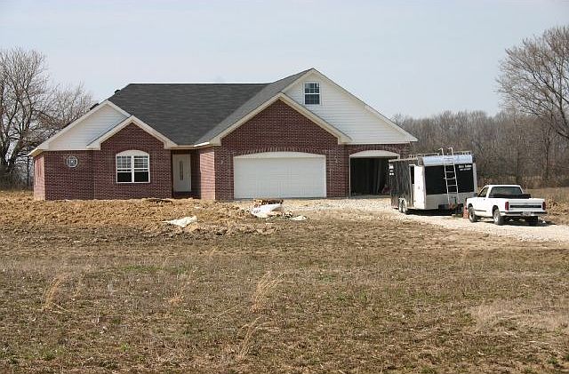 Custom 4 bdrm brick on 4.82 acres!