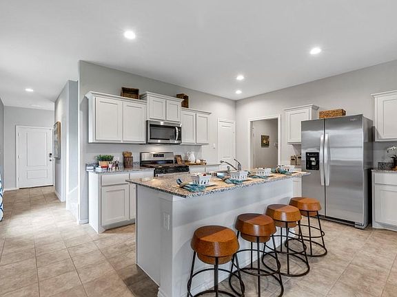Kitchen-All Home and community information, including pricing, included features, terms, availability and amenities, are subject to change at any time without notice or obligation. All Drawings, pictures, photographs, video, square footages, floor plans, elevations, features, colors and sizes are approximate for illustration purposes only and will vary from the homes as built.
