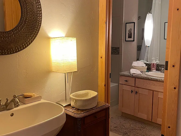 Guest bathroom with separate wc, shower and another sink so can be used by multiple people at once.