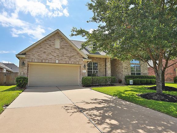 Double wide driveway to your 3 CAR GARAGE with central vacuum system for the inside of home.
