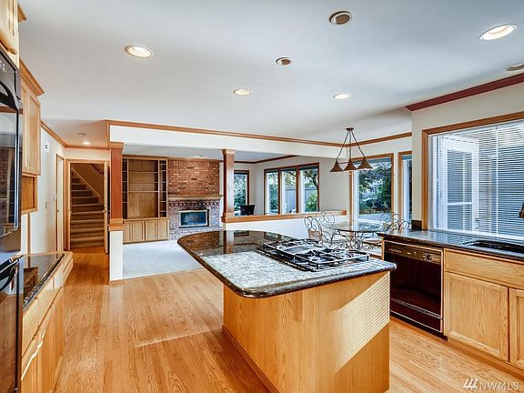 Large open kitchen with hardwoods, island and lots of natural light.