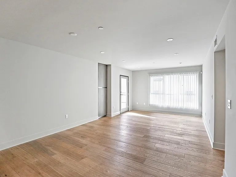 Large-Size Living Room Space with Vinyl Flooring and Patio