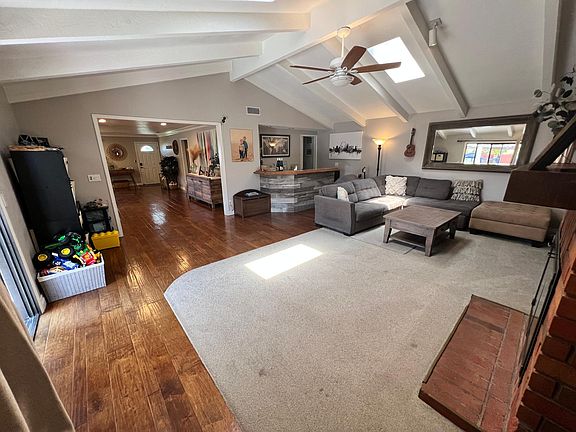 Living room with bar in middle background