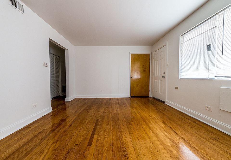 Spacious living room at 7706 S Saginaw!