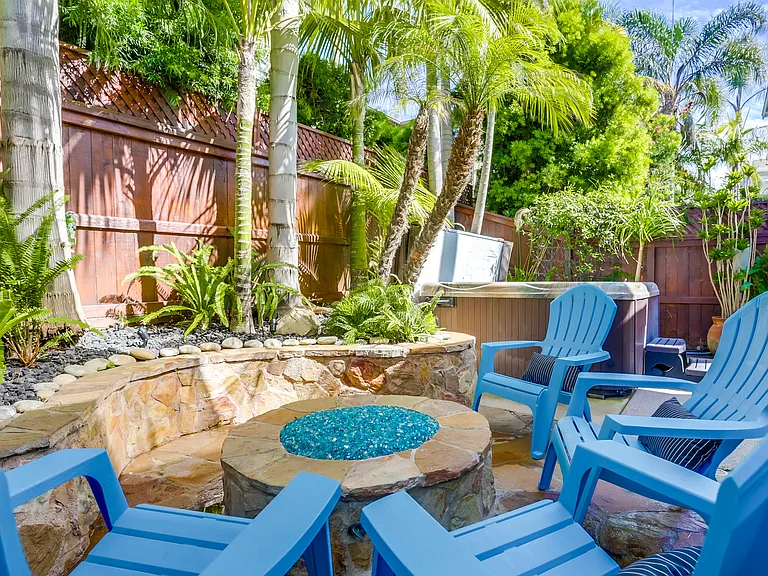 Backyard firepit perfect for entertaining or relaxing with 6 person hot tub and BBQ