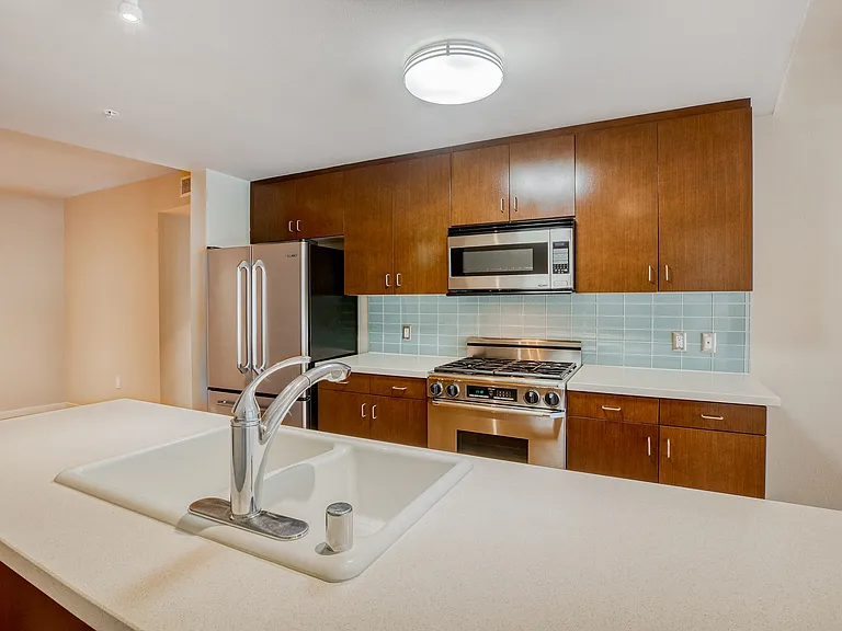 Kitchens are complete with Caesarstone countertops and decorative backsplash