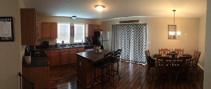 Kitchen with island and dining room : Spacious kitchen with centered island and dining room.