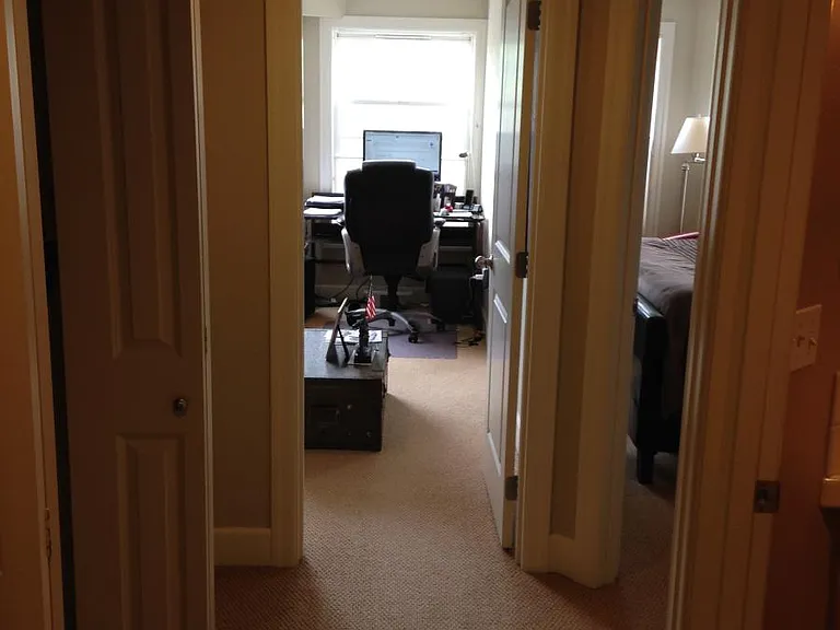 Hallway to two lower bedrooms and bath