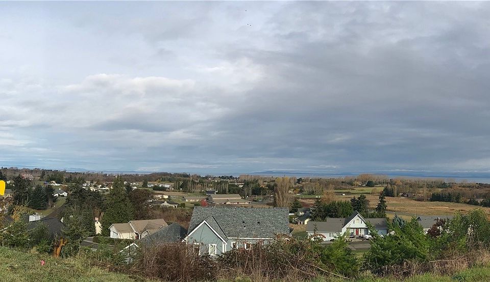 Viewing north over the East Dungeness Valley toward the Strait from Brigadoon.  Arrow shows Lot 10 by green house on left and red barn.