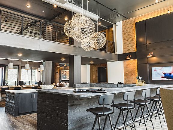 Entertain guests in our club room which features an entertainment kitchen, shuffleboard and fireplace