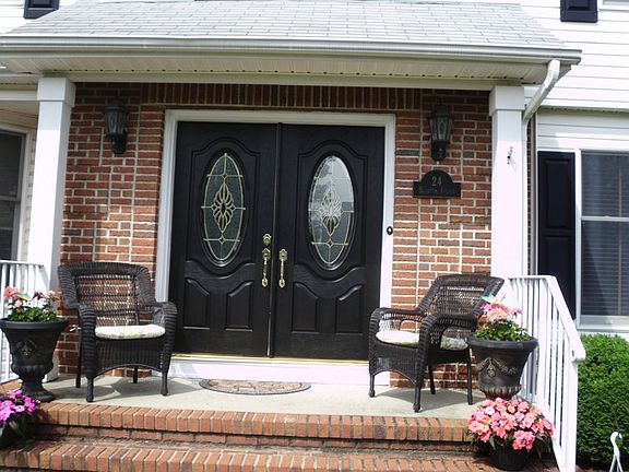 New columns on front entry porch and freshly painted doors.
