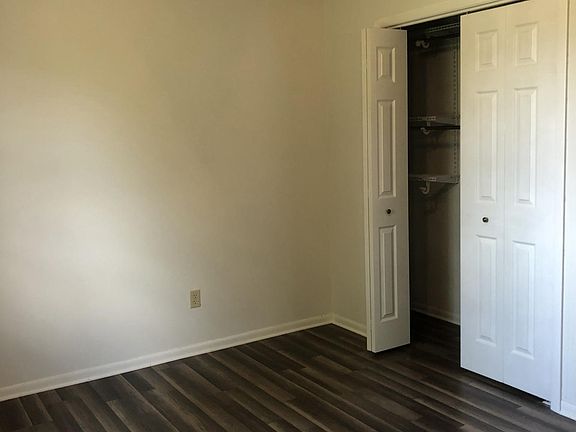 Master bedroom painted with new doors and hardwood floor